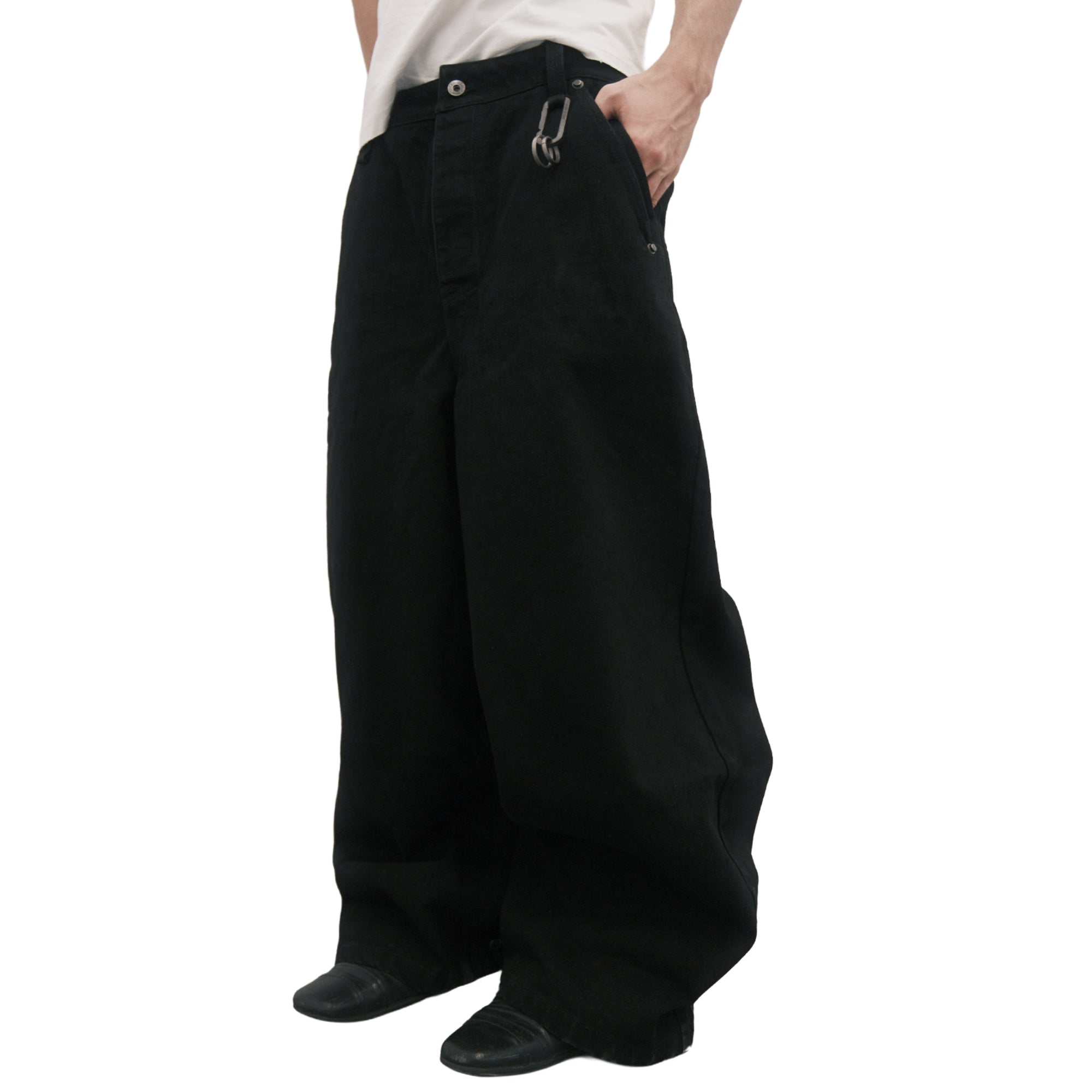 (of) void black denim jeans on male model at angled side view