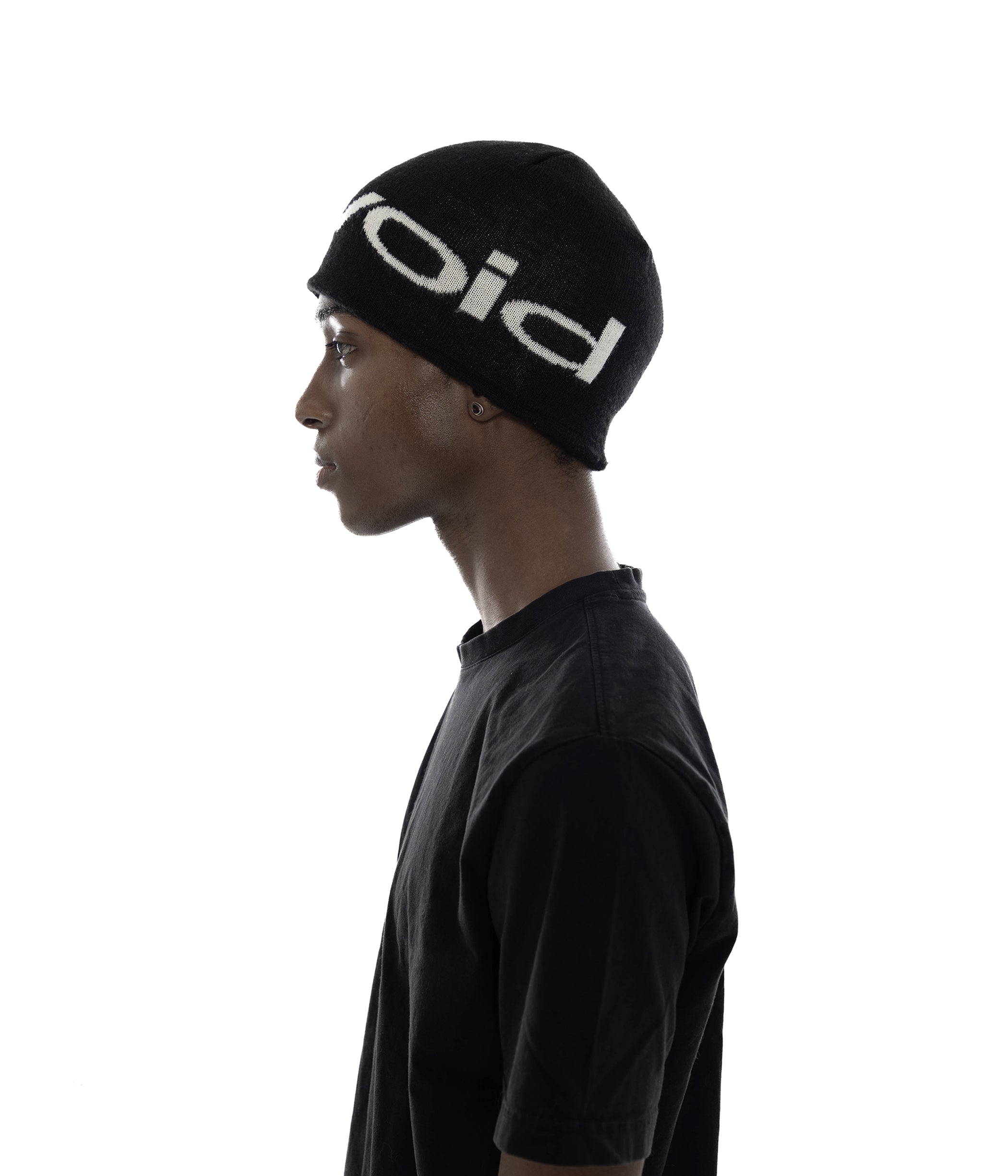 (of) void logo jacquard wool-blend beanie in black side view on male model