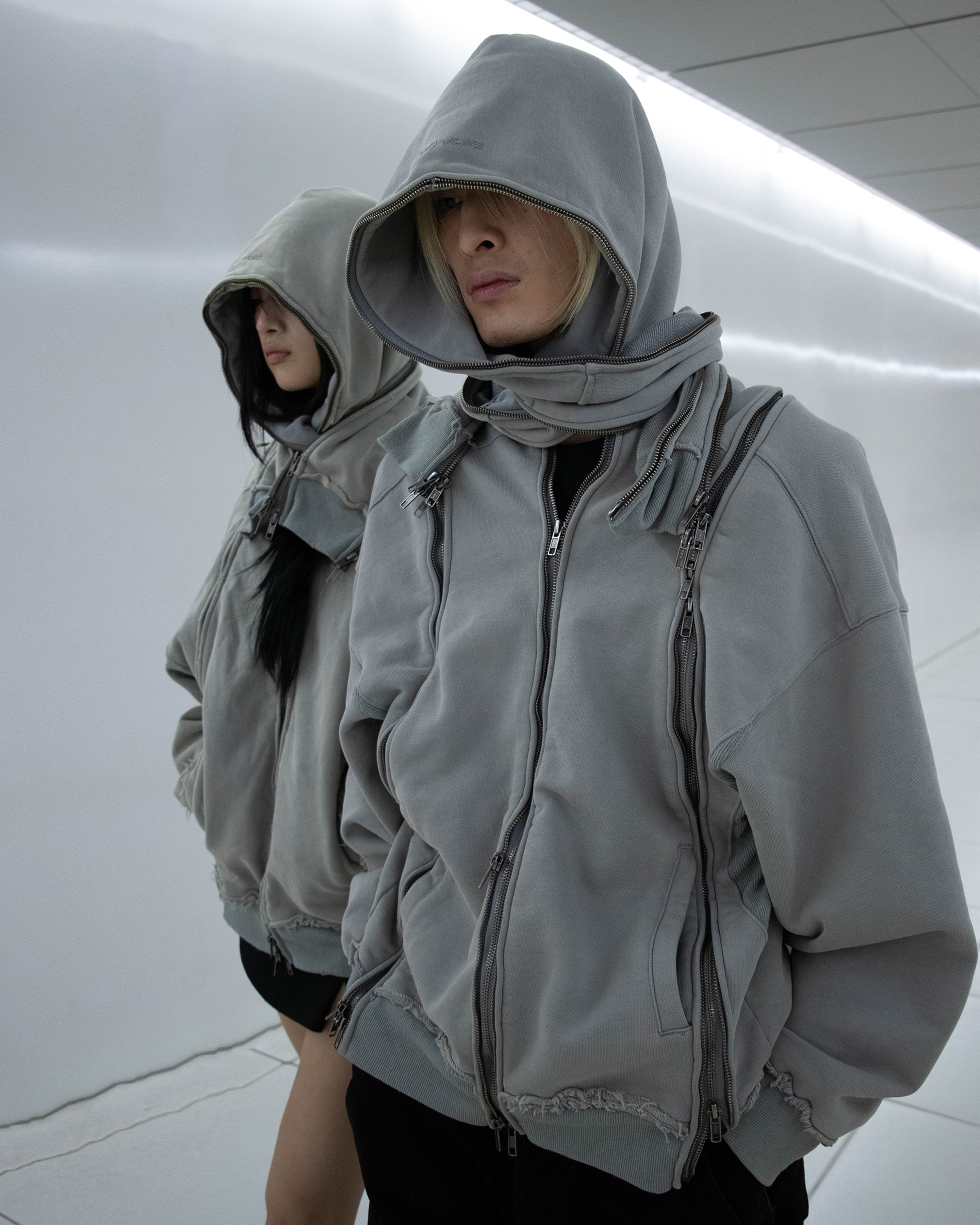 (of) void multi-zip hoodie campaign shoot photo of female and male models